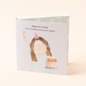 chocolate card, image of a woman with a big cake and a glass of fizz