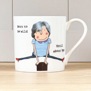 white mug with an image of a mature lady leap frogging a post, caption reads 'Born to be wild. Until about 9pm'.