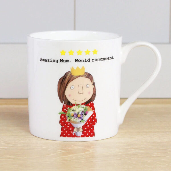 white mug with an image of a woman holding a bunch of flowers and wearing a gold crown, reads 'amazing mum, would recommend'.