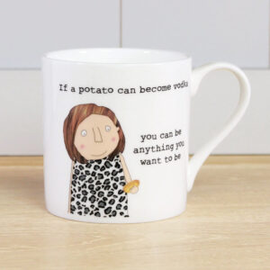 coffee mug with an image of a woman holding a potato, caption on the mug reads 'if a potato can become vodka, you can be anything you want to be'.