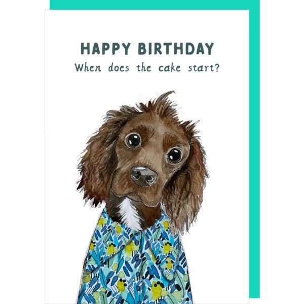 white birthday card with a cute little dog illustration, caption reads 'happy birthday when does the cake start?'